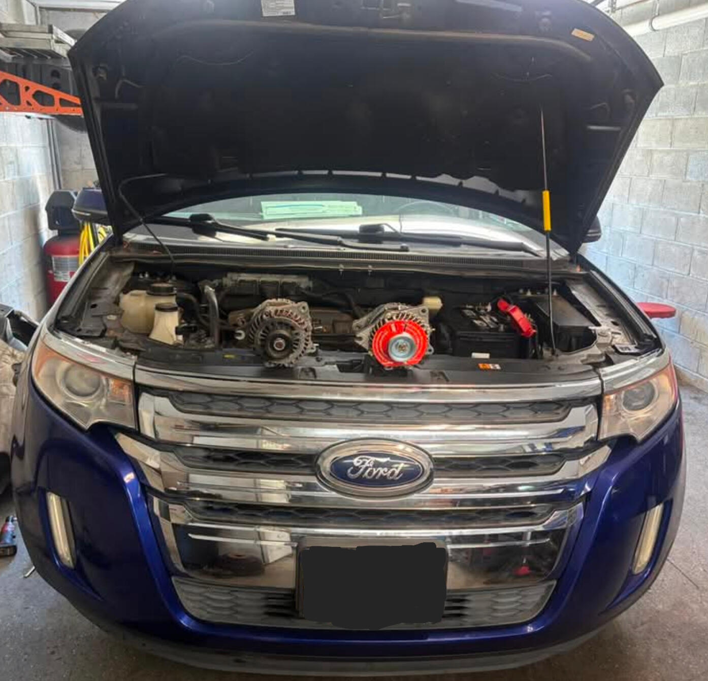 Mobile mechanic replacing an alternator on a Ford Edge in Fort Worth Texas